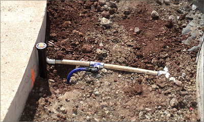 Positioning a sprinkler near a sidewalk using The Cobra Connector